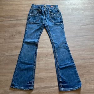 Tag jeans with studs around pockets. Size 25. Great condition